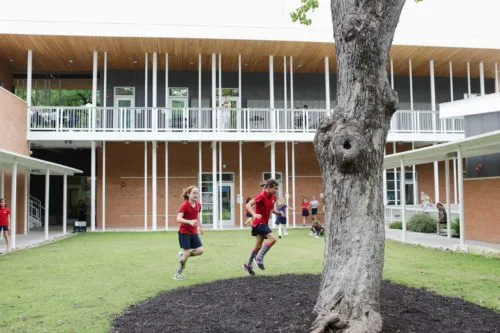 Two girls playing in the courtyard of The Girls School of Austin